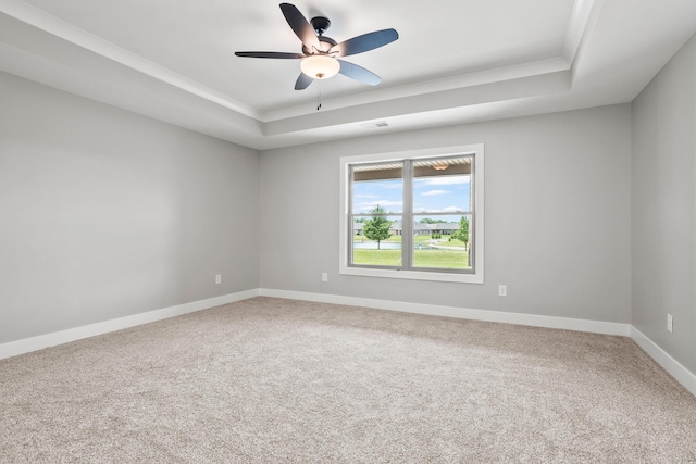 1160 Waterloo St, Troy, OH 45373 - carpeted spare room with a tray ceiling, ceiling fan, and crown molding