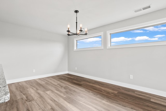 1160 Waterloo St, Troy, OH 45373 - unfurnished room with a chandelier and wood finished floors