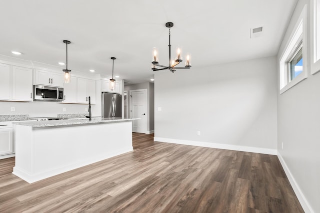 1160 Waterloo St, Troy, OH 45373 - kitchen featuring stainless steel appliances, recessed lighting, light wood-style floors, a chandelier, and a kitchen island with sink