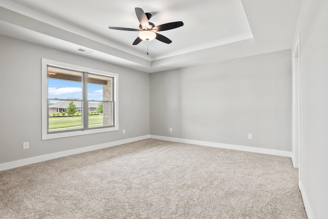 1160 Waterloo St, Troy, OH 45373 - carpeted spare room with a tray ceiling and a ceiling fan