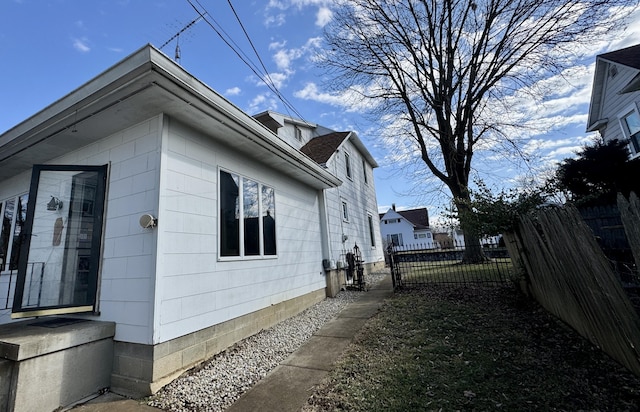 view of property exterior with fence