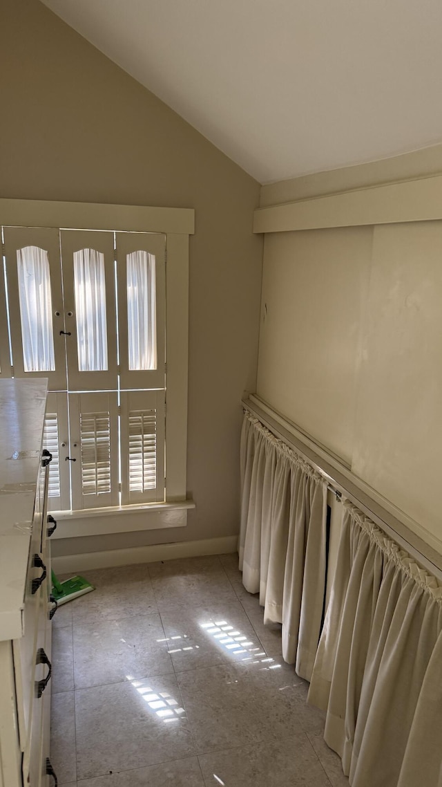 interior space featuring vaulted ceiling