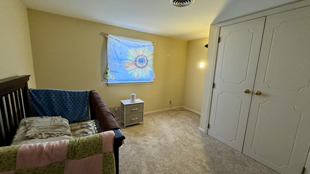 sitting room featuring carpet, visible vents, and baseboards