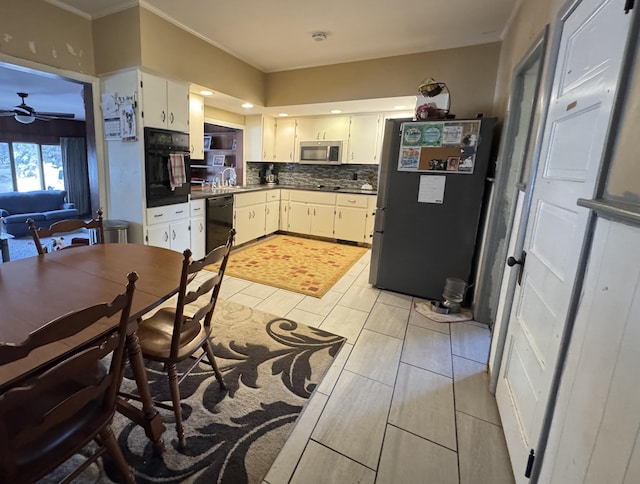 kitchen featuring ceiling fan, white cabinets, black appliances, tasteful backsplash, and dark countertops