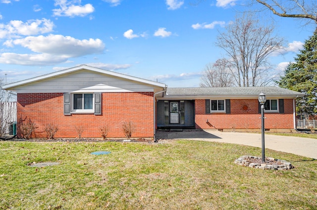 ranch-style house with driveway, crawl space, a front yard, and brick siding