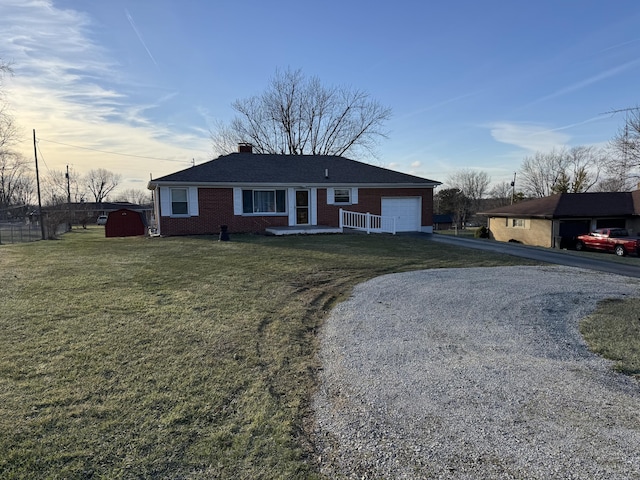 ranch-style house with a garage and a front lawn