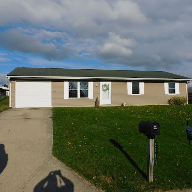 3210 Red Feather Rd, Sidney, OH 45365 - ranch-style house with an attached garage, driveway, and a front yard