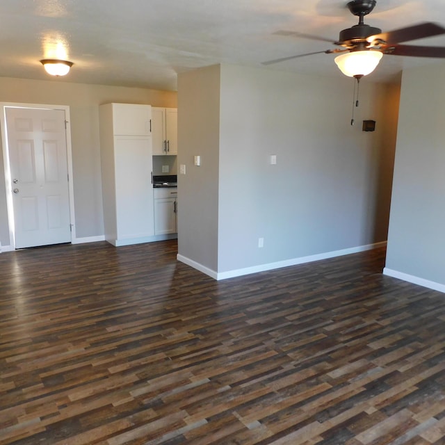 3210 Red Feather Rd, Sidney, OH 45365 - unfurnished living room with baseboards and dark wood-style floors