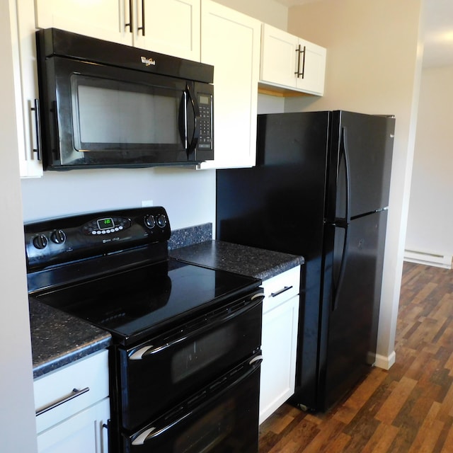 3210 Red Feather Rd, Sidney, OH 45365 - kitchen with black appliances, dark stone countertops, dark wood-type flooring, and white cabinets