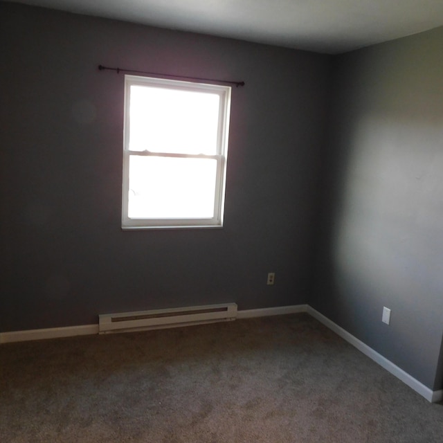 3210 Red Feather Rd, Sidney, OH 45365 - carpeted empty room with a baseboard radiator and baseboards