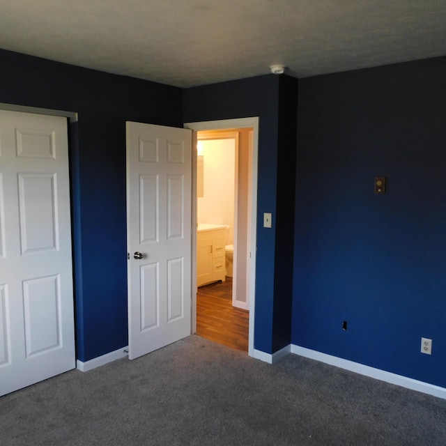 3210 Red Feather Rd, Sidney, OH 45365 - unfurnished bedroom with baseboards and carpet