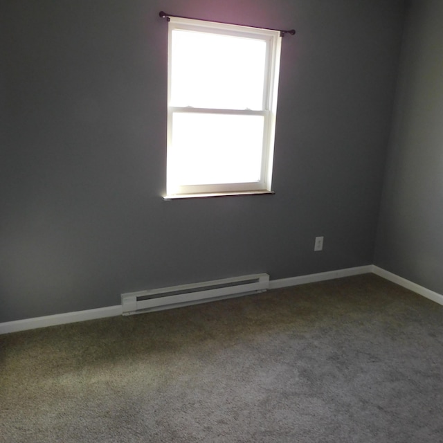3210 Red Feather Rd, Sidney, OH 45365 - empty room featuring baseboard heating, baseboards, and carpet floors