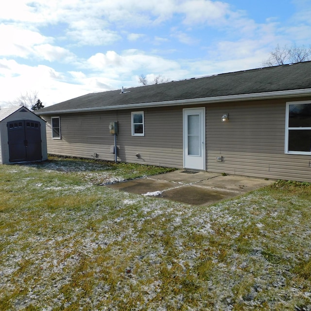 3210 Red Feather Rd, Sidney, OH 45365 - rear view of property featuring an outbuilding, a patio, and a storage shed