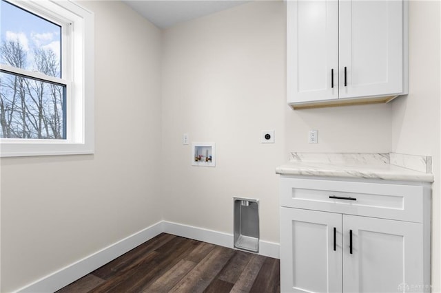 washroom featuring dark hardwood / wood-style floors, cabinets, hookup for an electric dryer, and hookup for a washing machine