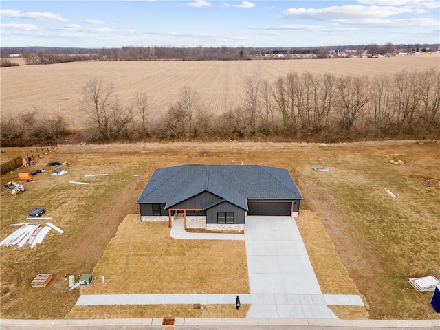 birds eye view of property with a rural view