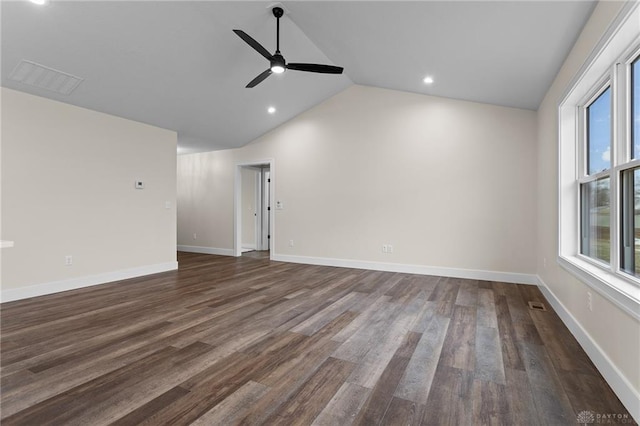 empty room featuring lofted ceiling, dark wood-type flooring, and ceiling fan