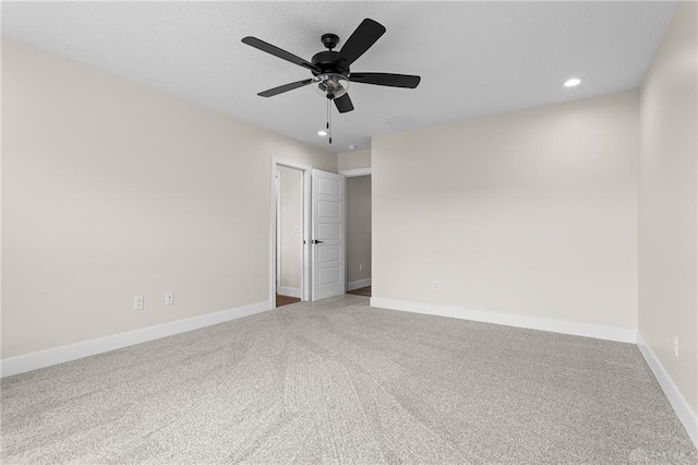 carpeted empty room with ceiling fan