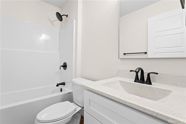 full bathroom with vanity, washtub / shower combination, and toilet