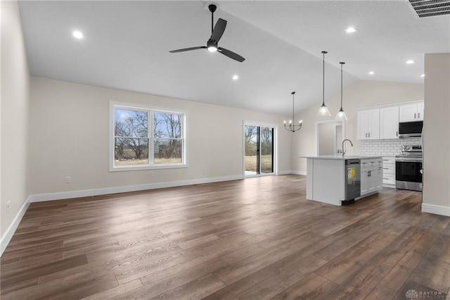 unfurnished living room featuring high vaulted ceiling, sink, ceiling fan with notable chandelier, and dark hardwood / wood-style flooring