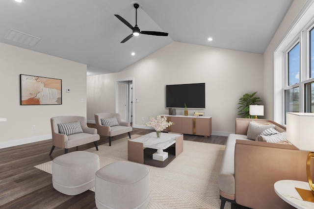 living area with a ceiling fan, vaulted ceiling, wood finished floors, and visible vents