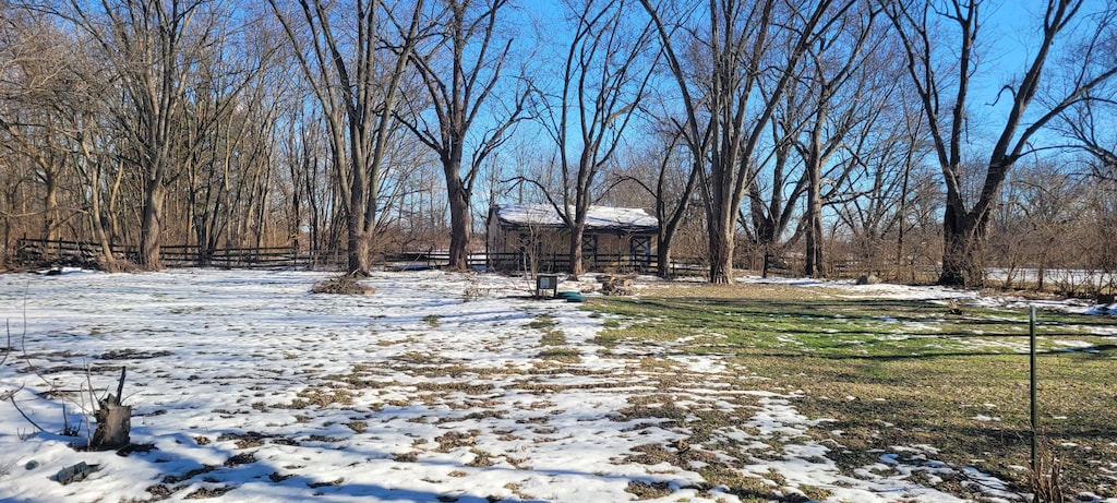 view of yard covered in snow