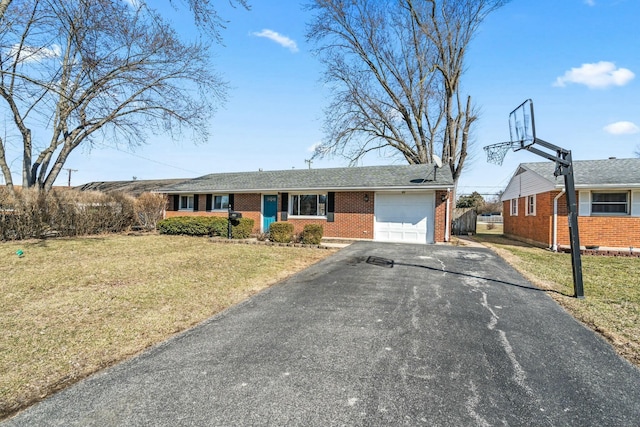 single story home with brick siding, aphalt driveway, a front lawn, and an attached garage