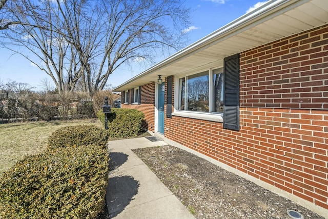 entrance to property with brick siding