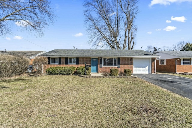 ranch-style house featuring brick siding, driveway, an attached garage, and a front lawn