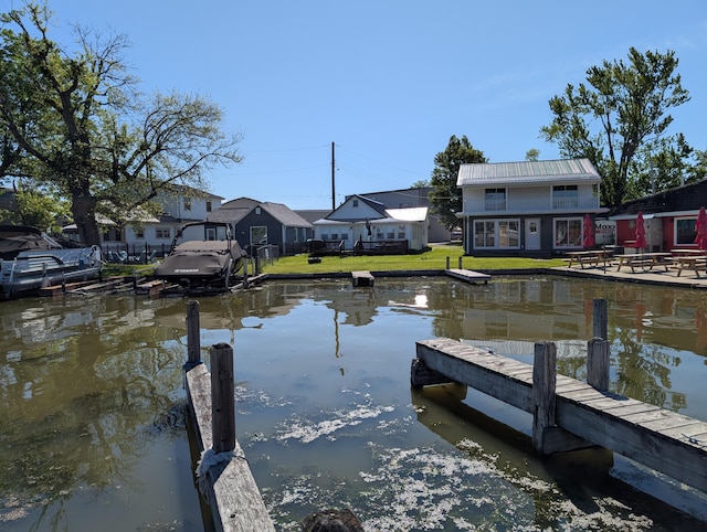 127 Brads Way, Russells Point, OH 43348 - dock area featuring a lawn and a water view