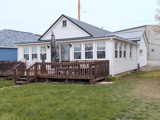 127 Brads Way, Russells Point, OH 43348 - back of house with a wooden deck, a yard, and a metal roof