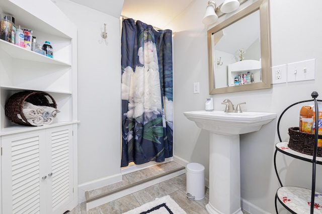 127 Brads Way, Russells Point, OH 43348 - bathroom with a sink and curtained shower