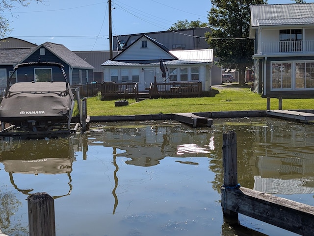 127 Brads Way, Russells Point, OH 43348 - dock area featuring boat lift and a yard