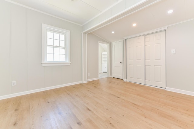 127 Brads Way, Russells Point, OH 43348 - unfurnished bedroom with light wood-style floors, ornamental molding, vaulted ceiling, recessed lighting, and a closet
