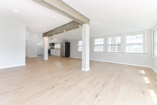 127 Brads Way, Russells Point, OH 43348 - unfurnished living room with light wood finished floors and recessed lighting