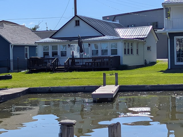 127 Brads Way, Russells Point, OH 43348 - dock area with a lawn and a deck