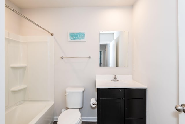 bathroom featuring vanity, shower / bathing tub combination, toilet, and baseboards