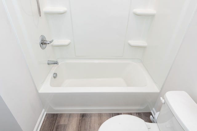 bathroom with toilet and wood finished floors