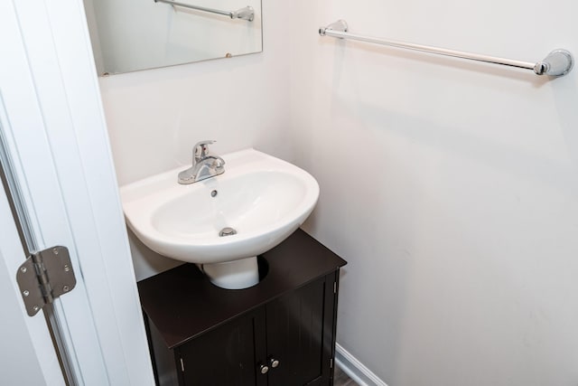 bathroom featuring vanity and baseboards