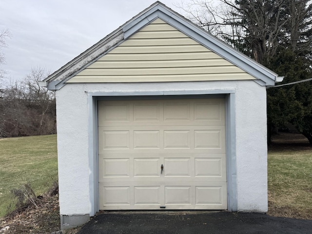 garage featuring a yard