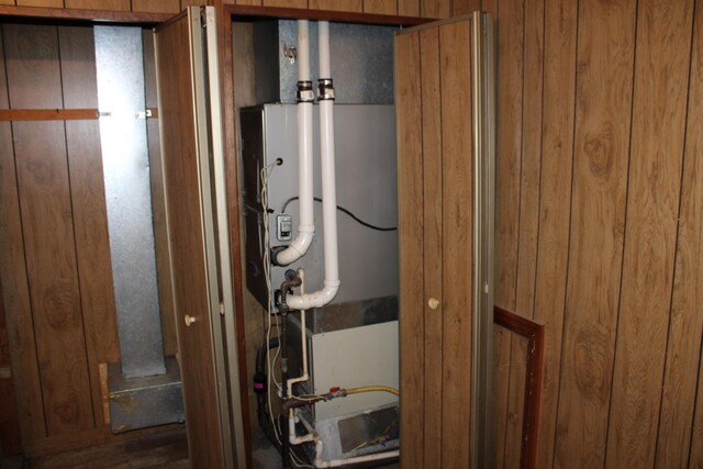 utility room with heating unit