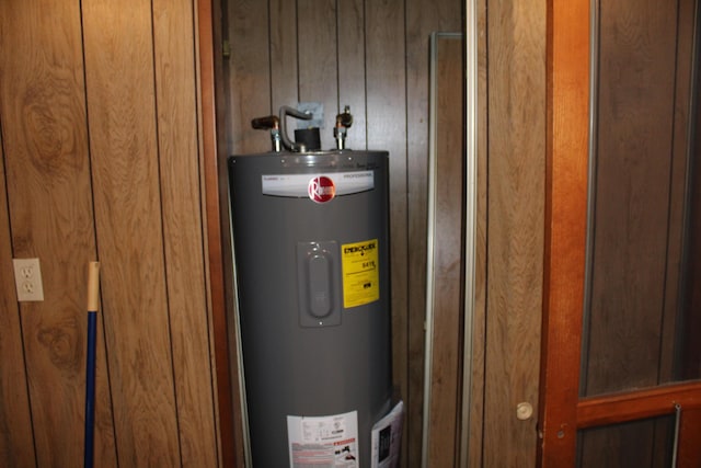 utility room featuring electric water heater