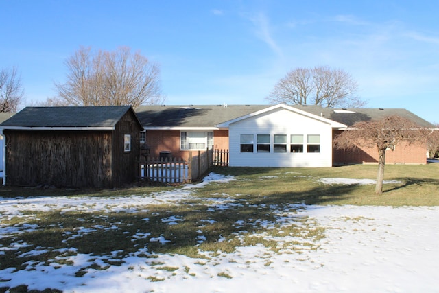 ranch-style house featuring a yard