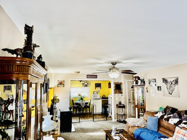 living room featuring carpet and ceiling fan