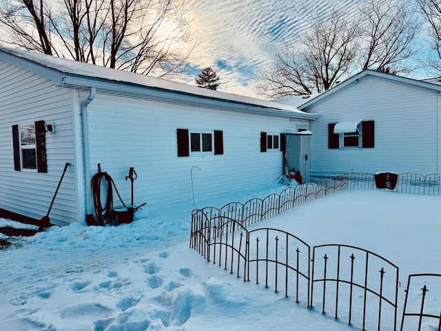 view of snow covered house