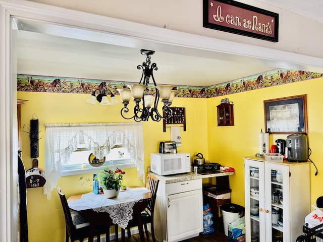 dining space featuring a chandelier