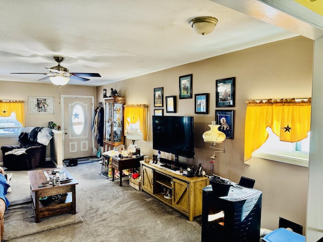 living room featuring ceiling fan and carpet flooring