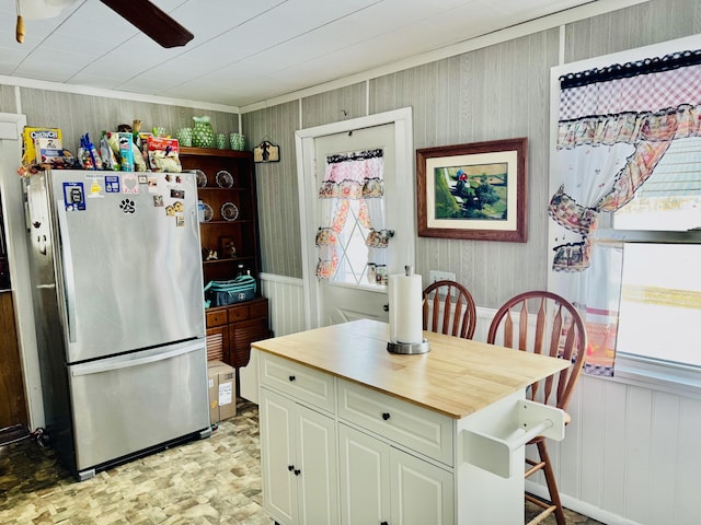 kitchen featuring stainless steel fridge and ceiling fan