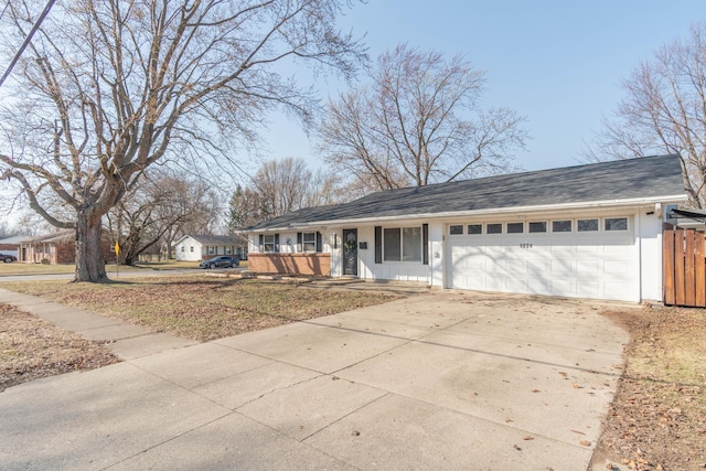 ranch-style house featuring driveway and an attached garage