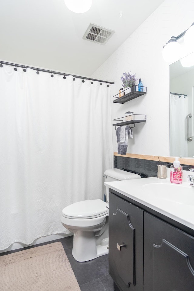 full bathroom with vanity, visible vents, tile patterned flooring, curtained shower, and toilet