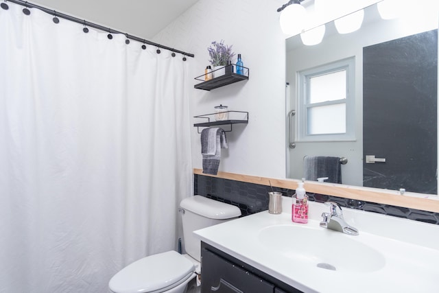 full bath featuring toilet and vanity